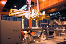 Vertical energy supply on a half-gantry crane