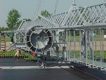 Transfer car for planting and irrigation in a Market-garden